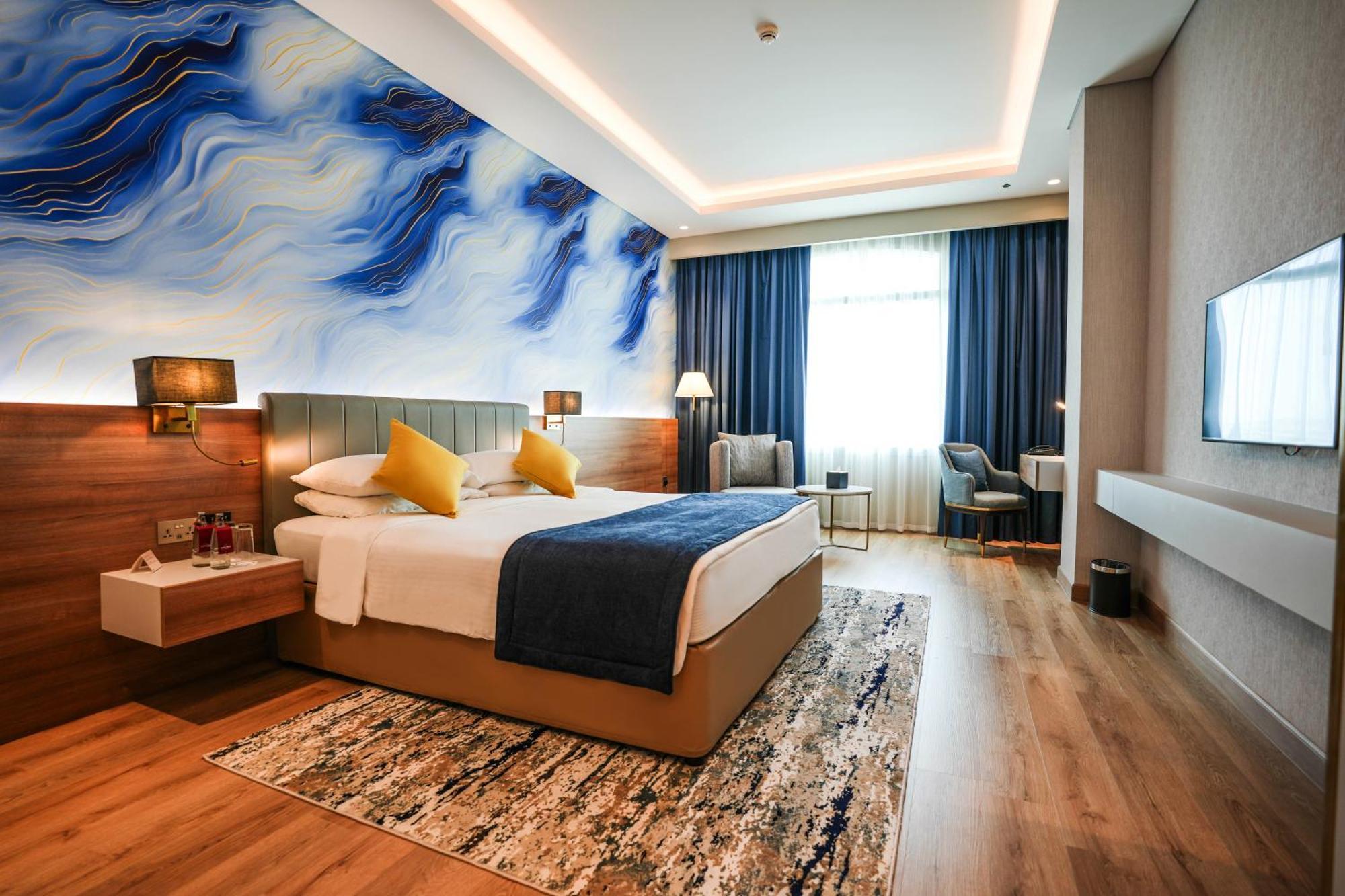 Moevenpick Grand Al Bustan Hotel Dubai Exterior foto Deluxe Room
